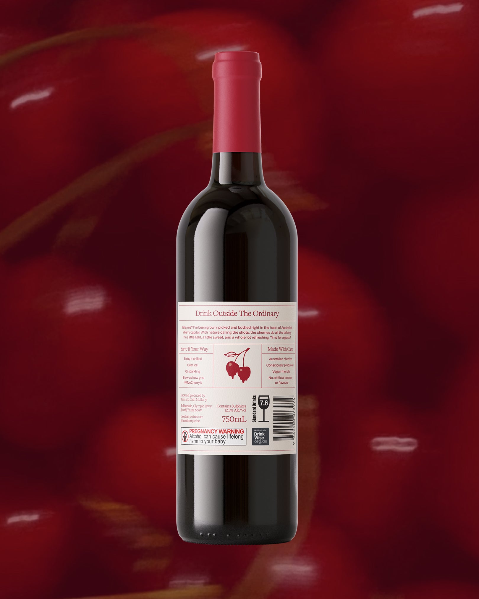 Back label of Mon Cherry wine bottle displaying product details, ingredients, and barcode on cherry background.
